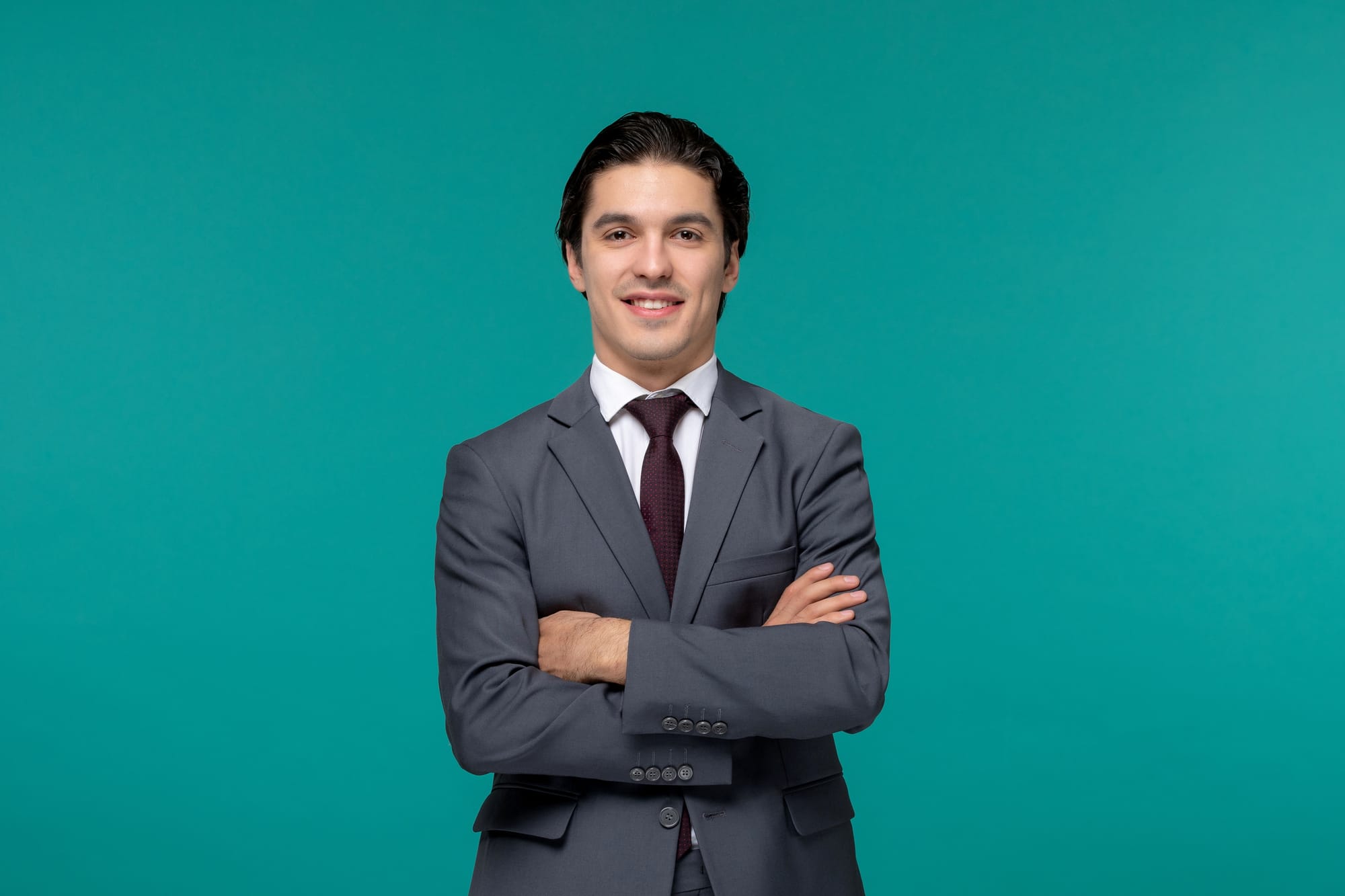 A professional headshots of a man posing in an authoritative yet welcoming manner